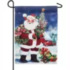 Evergreen 18 in. x 12.5 in. Christmas Barn Santa Garden Suede Flag