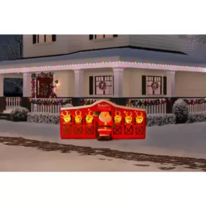 Home Accents Holiday 9 ft Giant-Sized LED Inflatable Santa's Stable with Reindeer